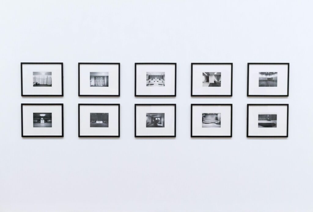 Simple and elegant wall display with black and white framed photographs in a modern interior.